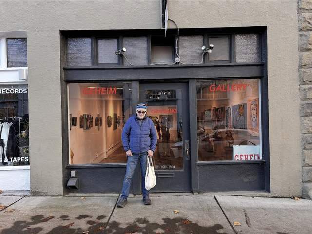 Frank standing outside Geheim Gallery on Bay Street on the night of his opening